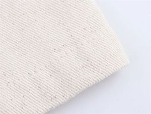 Macro shot of off-white twill canvas fabric detail and neat stitching on denim set