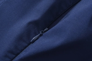 Macro shot of invisible zipper detail on navy blue sleeveless dress with high-quality fabric