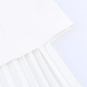 Macro detail of high-quality white pleated texture on a 2025 spring mini dress