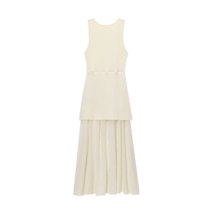 Detail of beige sleeveless knit dress featuring elegant pleated patchwork skirt design