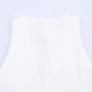 Detailed close-up of white mini dress neckline with center stitching and fine fabric texture