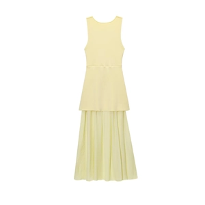 Detail of light yellow sleeveless dress with pleated skirt and layered knit texture