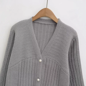Women's V-neck gray knit cardigan with vertical ribbed texture and pearl buttons