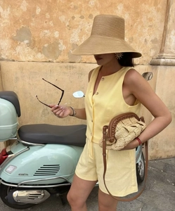 Chic yellow sleeveless vest and matching shorts set for women in summer holiday style