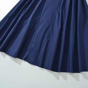Navy blue pleated midi dress for women featuring crisp folds and matte fabric texture