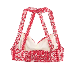 Women's halter crop top with red floral print and smocked open back design