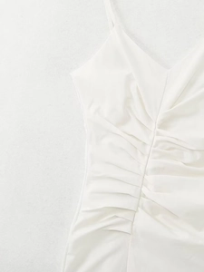 Detail view of white ruched V-neck camisole dress with delicate spaghetti straps