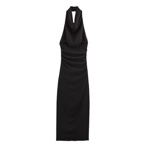 Detail view of the elegant black cowl neck and ruched waist on this midi halter dress