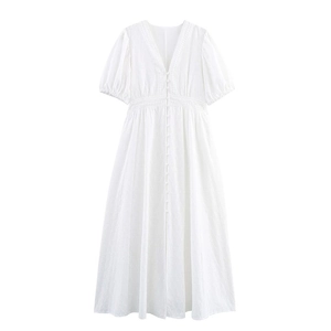 Detailed close-up of white V-neck eyelet lace embroidery and fabric buttons on the dress