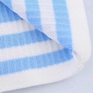 Close-up of blue and white striped knit sweater showing soft fabric and fine stitching