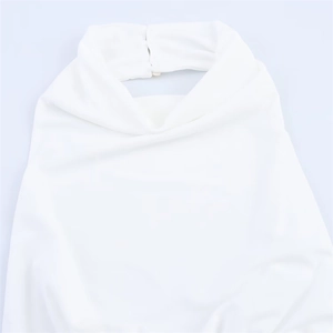Detail of white halter neck dress featuring gathered collar and button closure