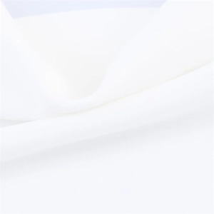 Close-up of white twill fabric detail showing soft texture and fine woven structure
