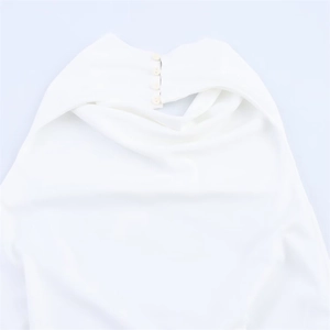 Close-up of elegant white halter neck dress featuring four-button back closure details