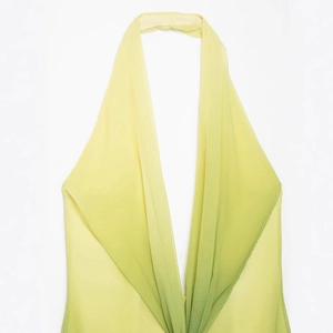 Sleeveless halter neck maxi dress with yellow to green gradient print and chiffon fabric