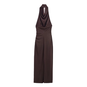 Detail view of smooth silk satin fabric and backless halter neck design on brown maxi dress