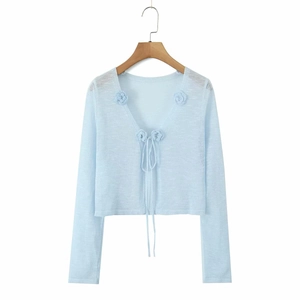 Light blue knit cardigan featuring 3D floral accents and front tie closure