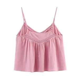 Pink cotton camisole top featuring lace trim and adjustable thin straps on white background