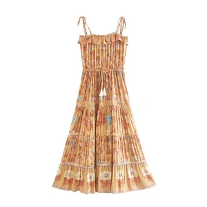 Bohemian floral maxi dress with adjustable straps and yellow tiered ruffle skirt