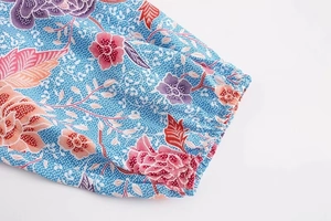 Close-up of elastic cuffs on a long-sleeved shirt with colorful floral print
