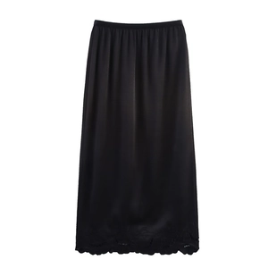 Elegant black satin midi skirt with floral embroidery and scalloped laser-cut hemline
