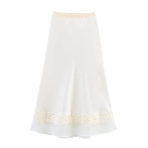Detailed view of elegant ivory satin skirt with intricate floral lace embroidery at the hem
