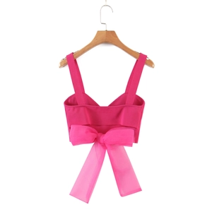 Slim fit hot pink camisole crop top featuring a large organza bow on the back