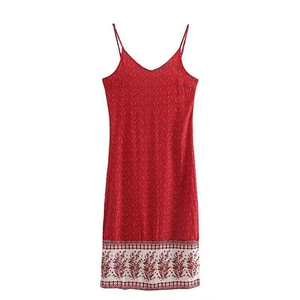 Detail of red floral print camisole dress featuring a vintage-style white hem border