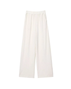 Detail of high waist wide leg pants showing creamy seersucker texture and elastic waistband