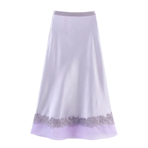 Detailed view of lavender A-line satin skirt with delicate lace trim and chiffon hemline