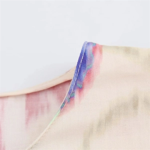 Detailed close-up of multi-color ink print fabric and high-quality stitching on set