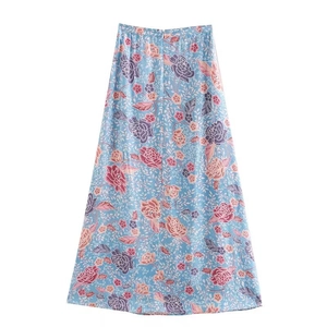 Detail of vintage rose print on light blue A-line midi skirt with side slit design