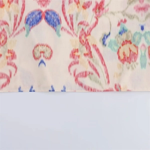 Detail of floral print fabric with linen texture and premium stitching on edges