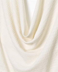 Macro shot of the white seersucker textured fabric with detailed crinkle effect
