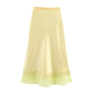 Elegant pale yellow satin midi skirt with lace trim and sheer chiffon hemline detail