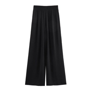 Women's black high-waisted wide leg pants with elastic waist and silky drape fabric