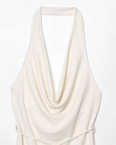 Detail view of white cowl neck halter top featuring textured seersucker fabric finish