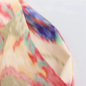 Detail of side pocket on abstract floral print trousers with high quality stitching