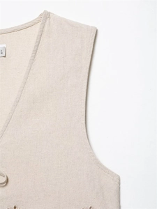 Close-up of oatmeal linen blend vest featuring V-neckline and intricate embroidery detail