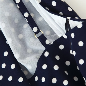 Polka dot halter midi dress in navy blue with gold adjustable ring buckle straps