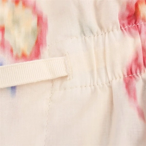 Macro detail of breathable fabric with colorful prints and elastic pleat stitching