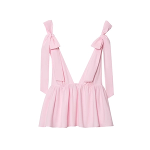 Close-up of pink poplin camisole featuring V-neckline and large self-tie shoulder bows