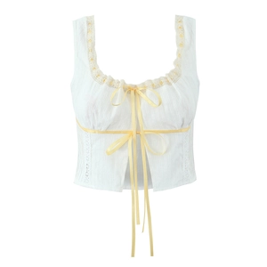 French style white sleeveless top with yellow ribbon bows and lace trim details
