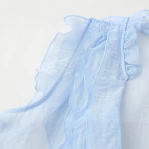 Light blue tiered ruffle top with elegant sheer organza texture for a modern feminine look