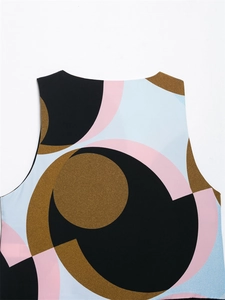 Detail of round neckline with colorful geometric print and smooth fabric texture