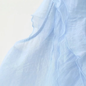 Light blue tiered ruffle top with elegant layered design and delicate fabric detail