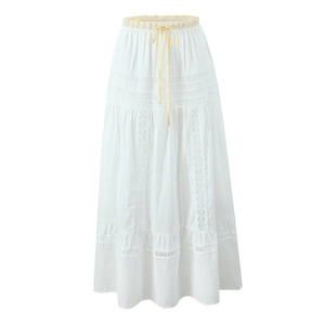 Elegant white tiered midi skirt with lace trim and pale yellow drawstring ribbon detail