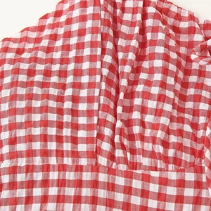 Red and white gingham maxi dress with ruffle detailing for early spring fashion