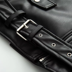 Black faux leather jacket with silver buckle belt and detailed metallic zippers