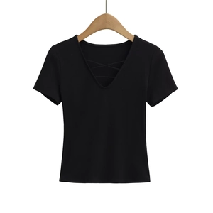 Detail of a women's black V-neck top with lace-up criss-cross front strings on a hanger
