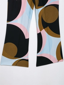 Macro shot of abstract geometric print on wide-leg pants with high-quality drape fabric